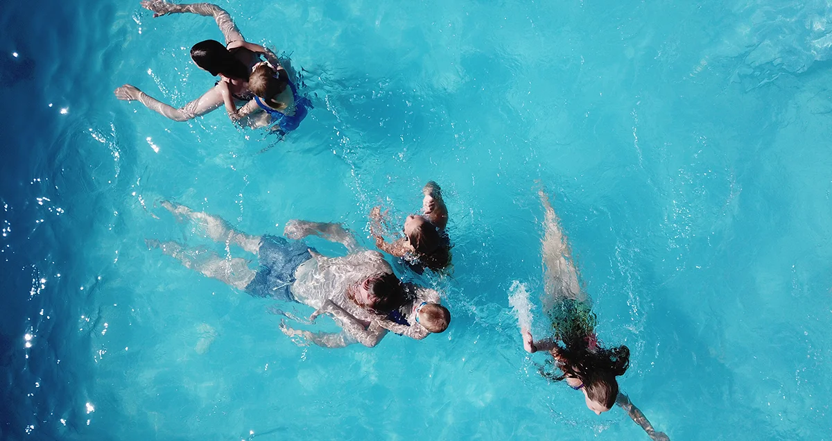 Family enjoys the pool during the family holiday