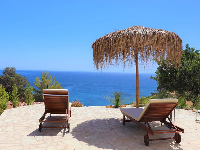 Terrace with sun chair, sun umbrella and seaview